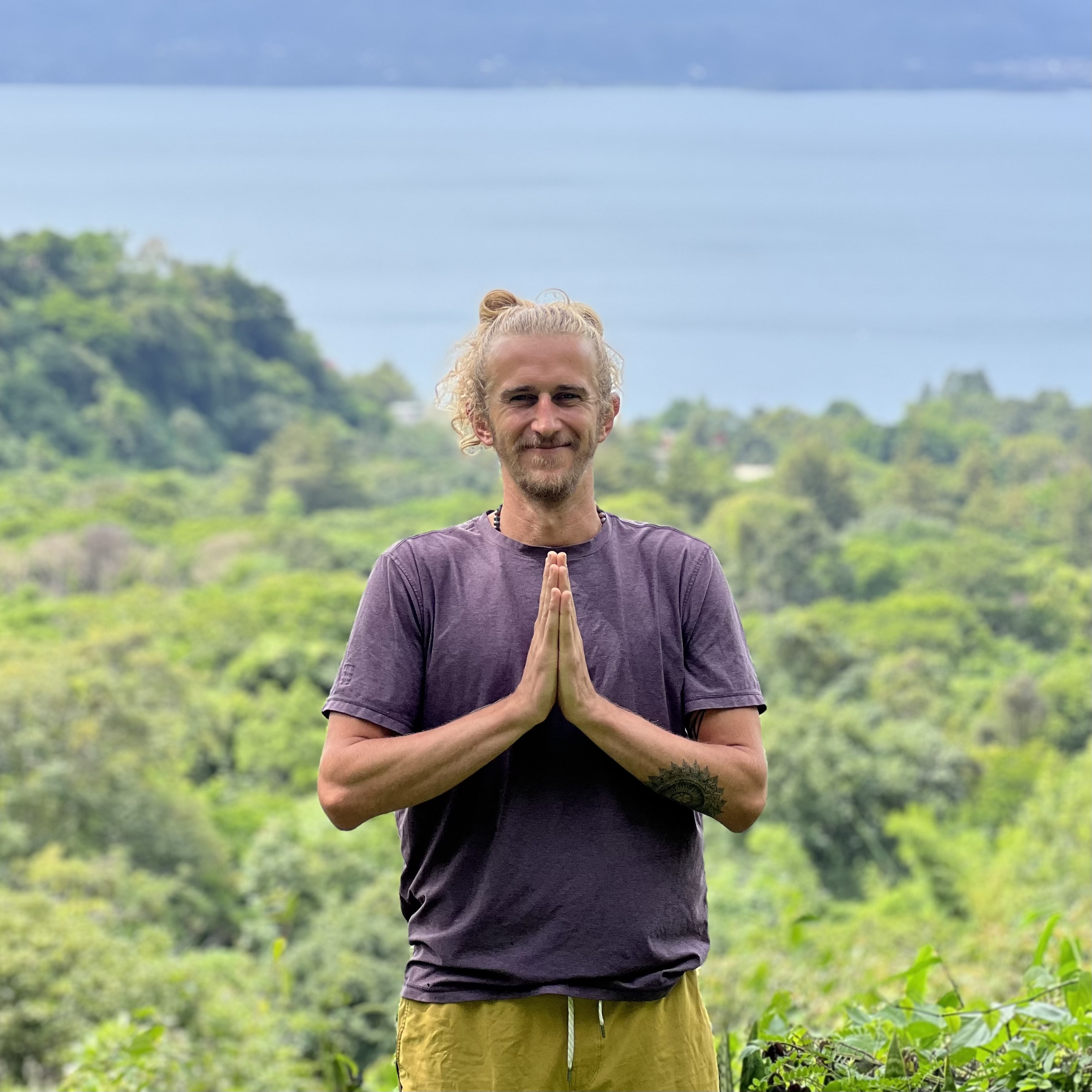 Yoga prayer pose at sunset